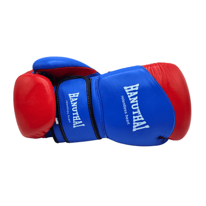 A pair of blue and red Hanuthai Muay Thai Boxing Gloves positioned against a green background.