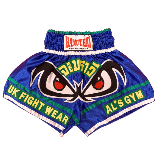 A pair of Evil Eyes Muay Thai boxing shorts with the words UK Fight Wear, made from the highest quality materials.