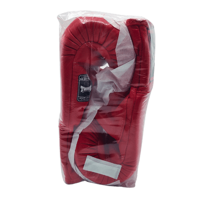 A Twins red boxing glove in a plastic bag suitable for Muay Thai training at Al's Gym.