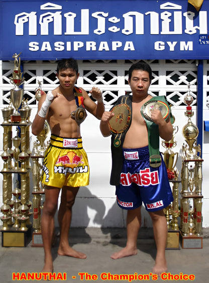 Two Hanuthai Muay Thai boxers posing for a photo, wearing Red Bull Charge boxing shorts.