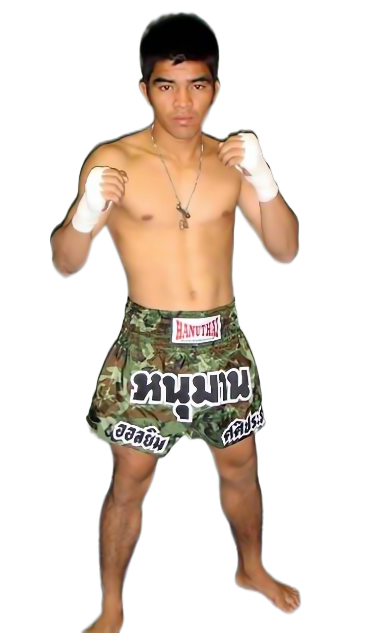 A young man in Hanuthai's Army Camo Muay Thai Boxing Shorts posing for a photo.