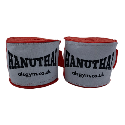 The Muay Thai Hand Wraps in red, by Hanuthai, feature "HANUTHAI" and "alsgym.co.uk" on white fabric. They are perfect for combat sports enthusiasts and designed with a secure Velcro closure for a snug fit.